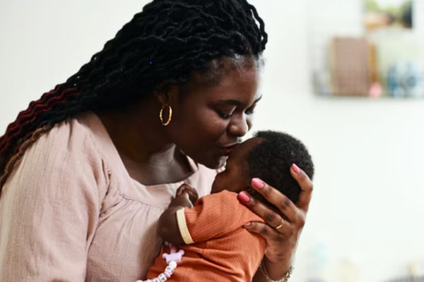 A mother Kissing her son after success of IVF at age 40