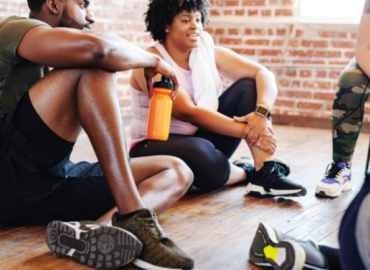 Embarking on Your Fitness Journey Tips for a Healthy and Active Life Group of African American men and women in athletic wear taking a break after exercise, symbolizing teamwork and motivation in their fitness journey.